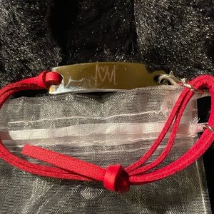 “Love” bracelet with red leather strap
